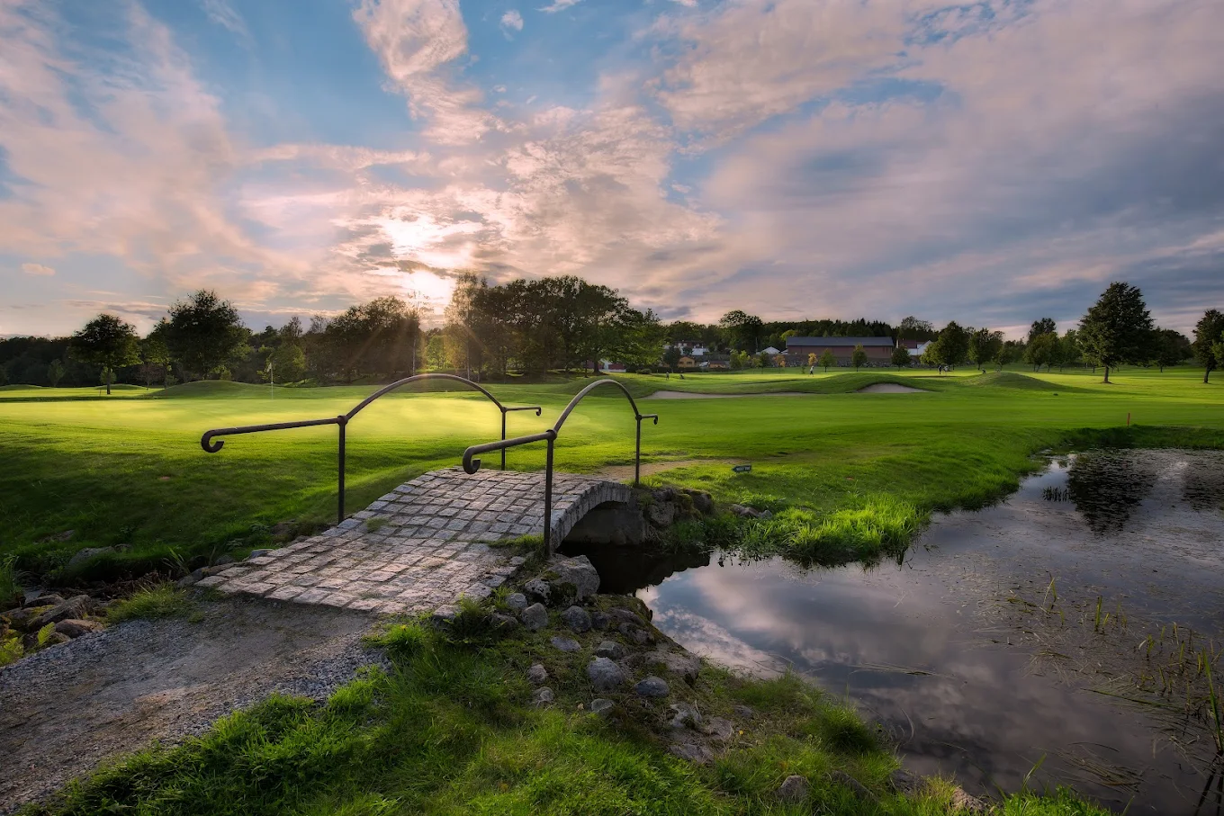 The stone footbridge over the creek at Drøbak Golfklubb at sunset
